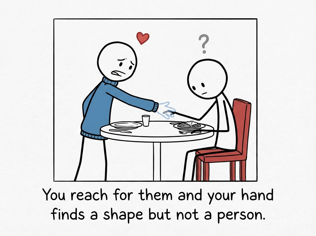 The figure reaches across the table to hold the other person's hand, but their hand passes slightly through -- the other person does not react, does not look up, does not squeeze back.